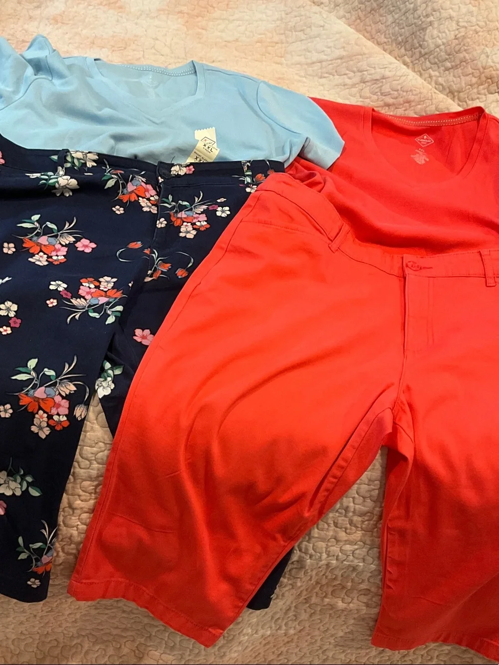 Coral Red V-Neck Top with Floral Navy Pants and Light Blue Tee